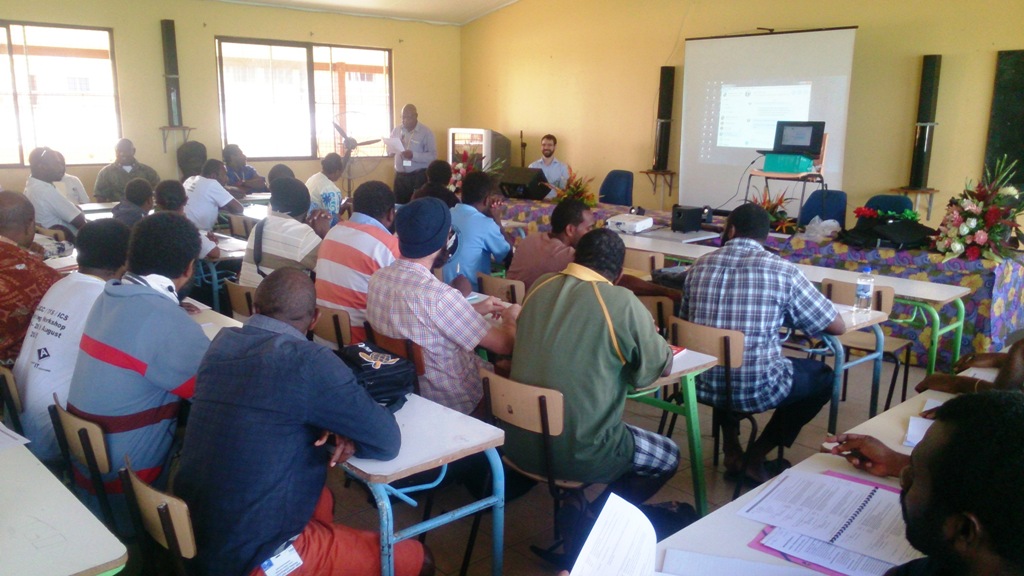 Participants listening to an address by Ian Thomson, E-Learning advisor at USP, Suva